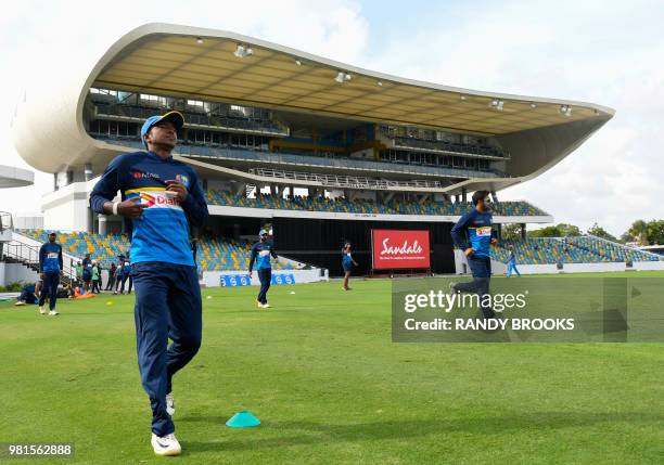 Akila Dananjaya of Sri Lanka takes part in a training session one day before the 3rd Test between West Indies and Sri Lanka at Kensington Oval,...