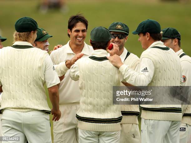 Mitchell Johnson of Australia is congratulated on his wicket of Martin Guptill of New Zealand during day five of the Second Test match between New...