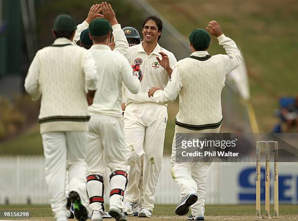 Mitchell Johnson of Australia celebrates his dismissal of Brent Arnel of New Zealand during day five of the Second Test match between New Zealand and...