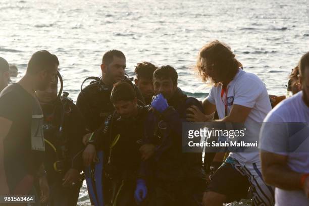 Adnan Nassrat is greeted as he returns from a successful 48-hour long dive on June 22, 2018 in Aqaba, Jordan. Hassnat seeks to break the Guinness...