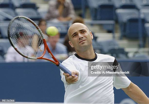 Andre Agassi loses to top-seeded Roger Federer in the quarter finals of the men's singles September 9, 2004 at the 2004 US Open in New York.