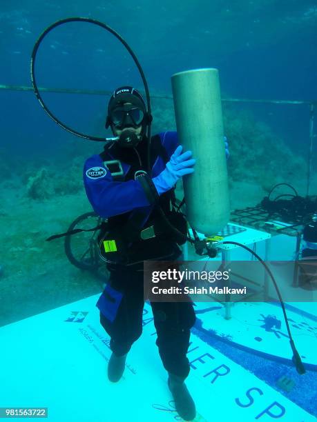 Adnan Nassrat attempts a 48-hour long dive on June 22, 2018 in Aqaba, Jordan. Hassnat seeks to break the Guinness World Record of six days under sea...