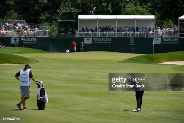 Brian Harman plays a shot on the ninth fairway during the second round of the Travelers Championship at TPC River Highlands on June 22, 2018 in...