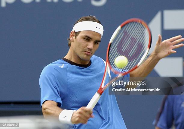 Roger Federer defeats Tim Henman, 6-3, 6-4, 6-4, in a semi final, men's singles match September 11, 2004 at the 2004 US Open in New York.