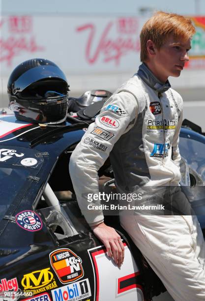 Cole Keatts, driver of the Peters & Keatts Equipment Ford, stands in the garage area during practice for the NASCAR K&N Pro Series West Carneros 200...