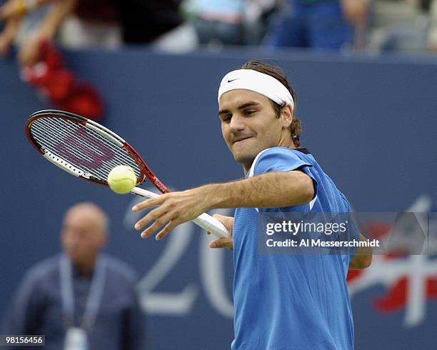 Roger Federer defeats Tim Henman, 6-3, 6-4, 6-4, and hits a celebration ball into the stands in a semi final, men's singles match September 11, 2004...