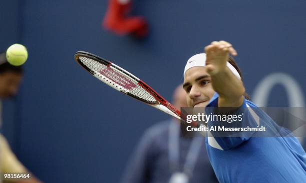 Roger Federer defeats Tim Henman, 6-3, 6-4, 6-4, in a semi final, men's singles match September 11, 2004 at the 2004 US Open in New York.