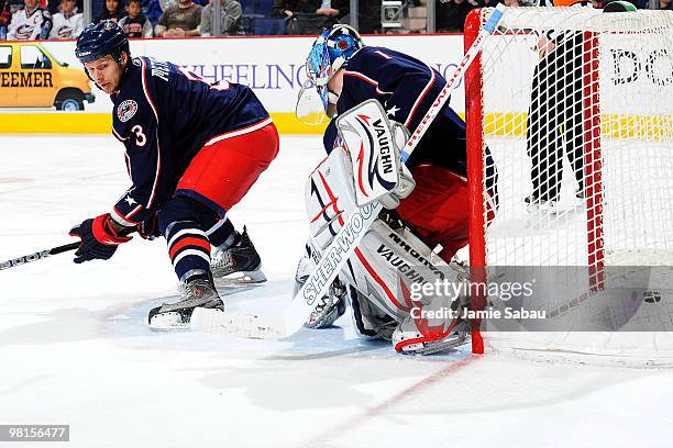 Marc Methot and goaltender Steve Mason, both of the Columbus Blue Jackets, fail to stop the shot from Vincent Lecavalier of the Tampa Bay Lightning...