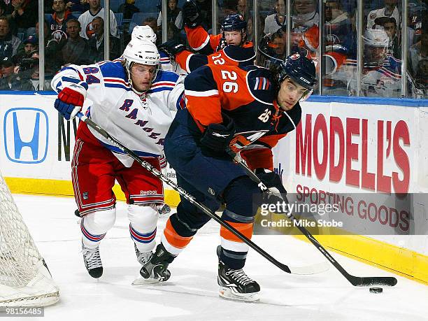 Corey Locke of the New York Rangers, playing in his first NHL game, pursues Matt Moulson of the New York Islanders on March 30, 2010 at Nassau...