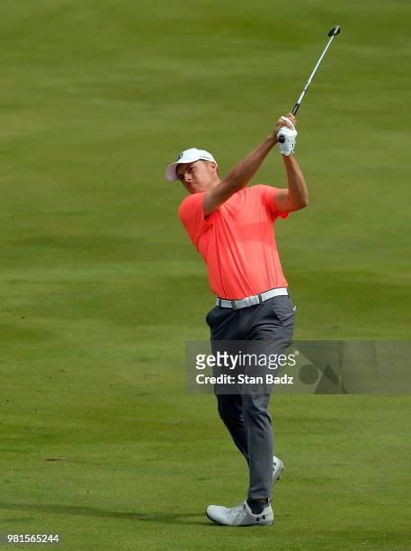 Jordan Spieth plays a shot on the first hole during the second round of the Travelers Championship at TPC River Highlands on June 22, 2018 in...