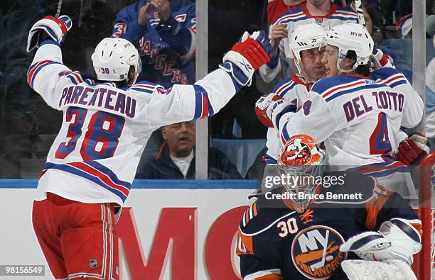 Vaclav Prospal of the New York Rangers celebrates his second period goal with PA Parenteau and Michael Del Zotto against Dwayne Roloson of the New...