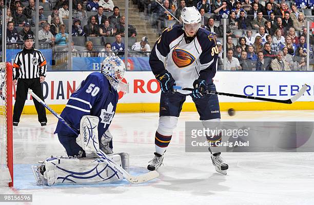 Nik Antropov of the Atlanta Thrashers is stopped in close by Jonas Gustavsson of the Toronto Maple Leafs March 30, 2010 at the Air Canada Centre in...