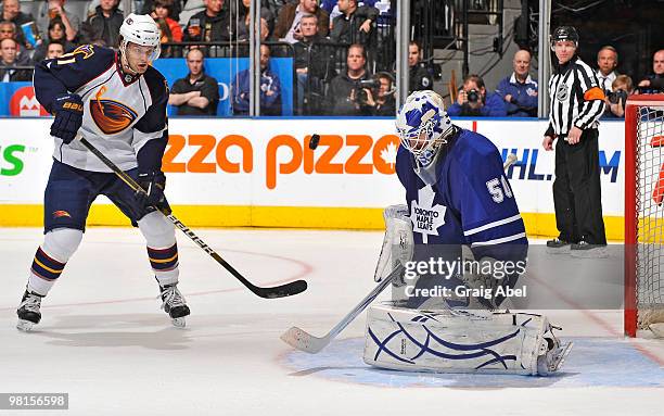 Clarke MacArthur of the Atlanta Thrashers is stopped in close by Jonas Gustavsson of the Toronto Maple Leafs March 30, 2010 at the Air Canada Centre...