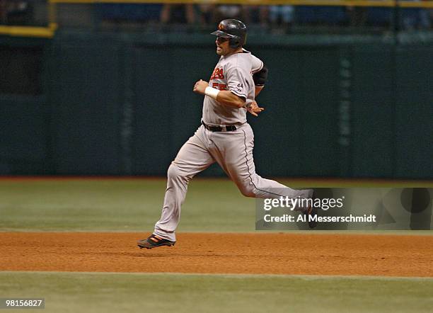 Baltimore Orioles catcher Ramon Hernandez dashes to third base against the Tampa Bay Devil Rays July 21, 2006 at Tropicana Field. The Rays scored six...