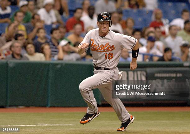 Baltimore Orioles first baseman Jeff Conine rounds third base and scores against the Tampa Bay Devil Rays at Tropicana Field in St. Petersburg,...