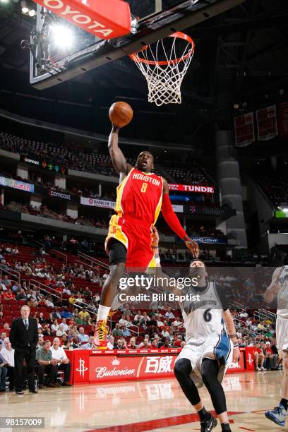 Jermaine Taylor of the Houston Rockets shoots the ball over Mike Miller of the Washington Wizards on March 30, 2010 at the Toyota Center in Houston,...