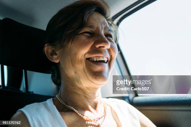 close-up of senior woman in a car - 60 carat stock pictures, royalty-free photos & images