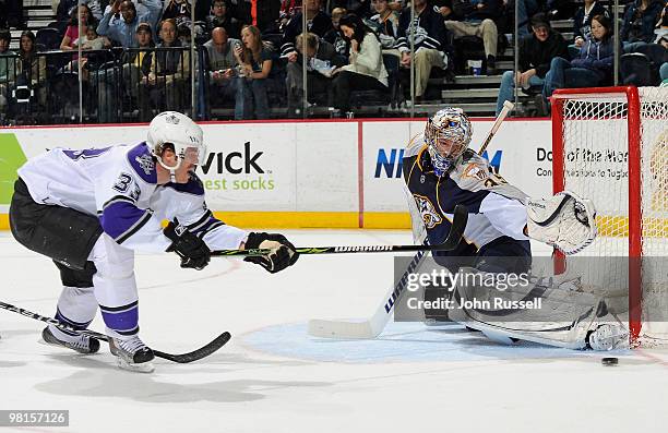 Pekka Rinne of the Nashville Predators kicks at a shot fired wide by Fredrik Modin of the Los Angeles Kings on March 30, 2010 at the Bridgestone...