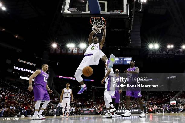 Qyntel Woods of 3 Headed Monsters dunks against the Ghost Ballers during week one of the BIG3 three on three basketball league at Toyota Center on...