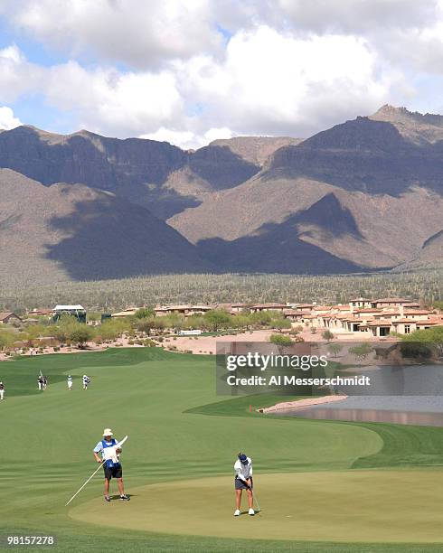 Golfer finishes on the 18th green during the third round of the 2007 Safeway International at Superstition Mountain Golf and Country Club March 24,...