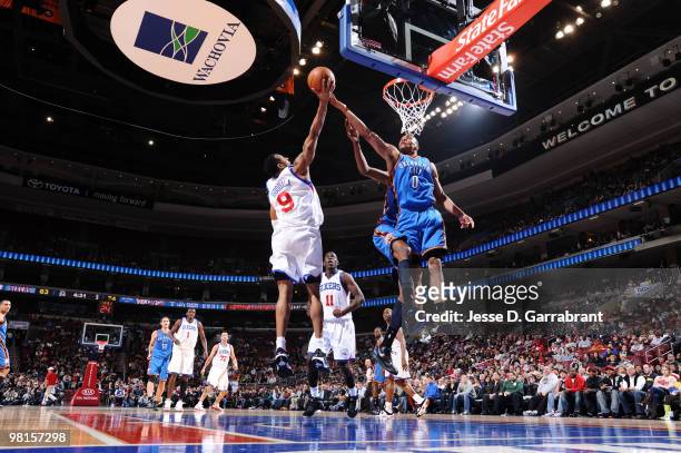 Andre Iguodalal of the Philadelphia 76ers grabs the rebound against Russell Westbrook of the Oklahoma City Thunder during the game on March 30, 2010...