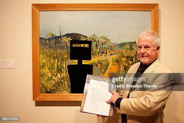 Lou Klepac Chairman of The Gleeson O'Keefe Foundation poses with Australian painter Sidney Nolan's 'First Class Marksman' which is unveilled as the...