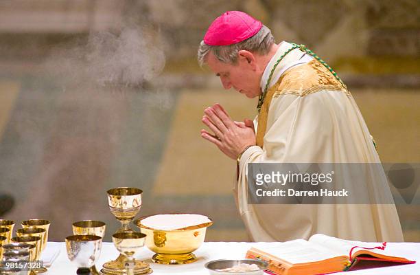 Milwaukee Archbishop Jerome Listecki blesses the gifts during the evening Chrism Mass at the Cathedral of St. John the Evangelist March 30, 2010 in...