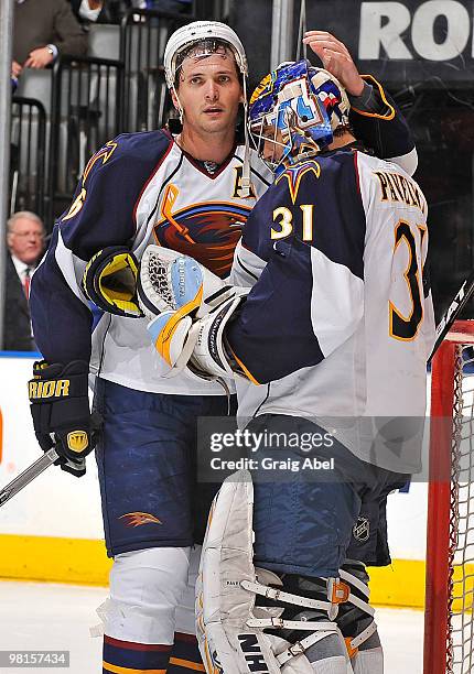 Ron Hainsey and Ondrej Pavelec of the Atlanta Thrashers celebrate the team's win over the Toronto Maple Leafs during game action March 30, 2010 at...