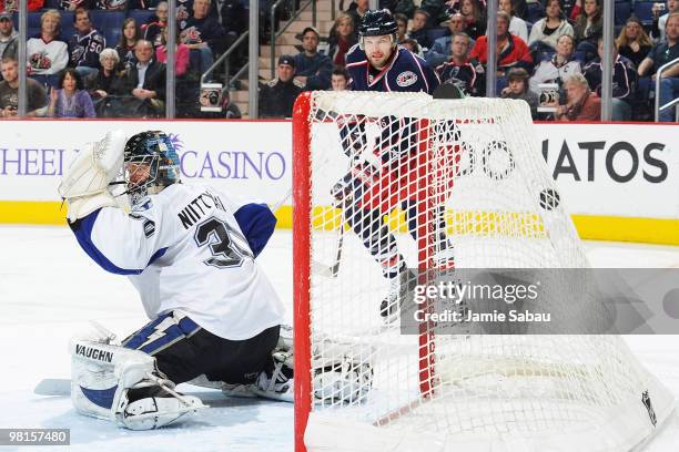 Rick Nash of the Columbus Blue Jackets watches as a shot from teammate Fedor Tyutin beats goaltender Antero Niittymaki of the Tampa Bay Lightning...