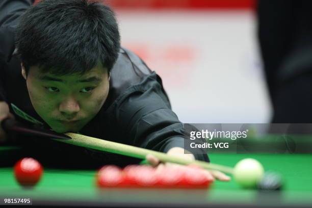 Ding Junhui of China plays a shot in his match against Gerald Green of Northern Ireland during day two of the 2010 Snooker China Open at Beijing...