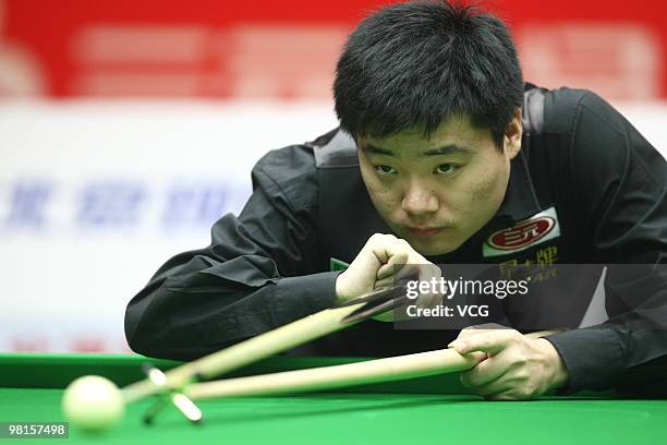 Ding Junhui of China plays a shot in his match against Gerald Green of Northern Ireland during day two of the 2010 Snooker China Open at Beijing...