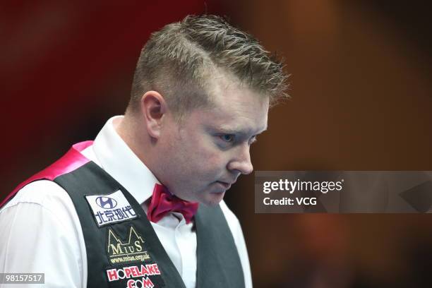 Gerald Green of Northern Ireland plays a shot in his match against Ding Junhui of China during day two of the 2010 Snooker China Open at Beijing...