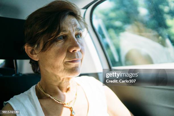 close-up of senior woman in a car - 60 carat stock pictures, royalty-free photos & images