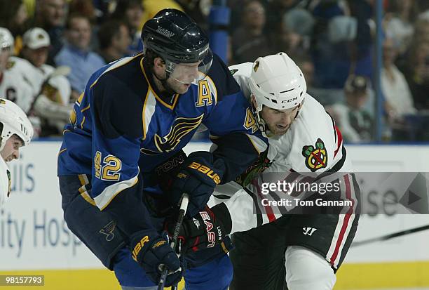 David Backes of the St. Louis Blues skates against Andrew Ladd of the Chicago Blackhawks on March 30, 2010 at Scottrade Center in St. Louis, Missouri.