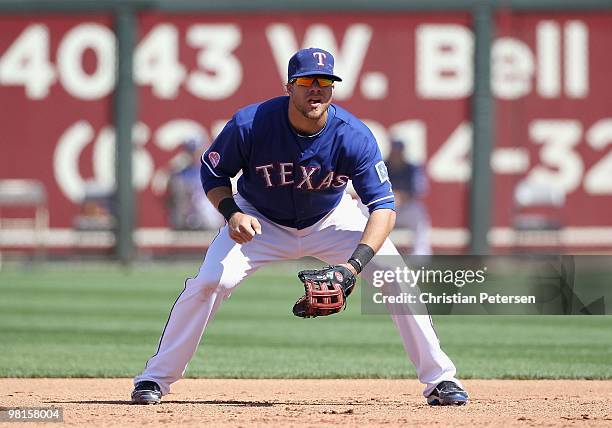Infielder Chris Davis of the Texas Rangers in action during the MLB spring training game against the Cleveland Indians at Surprise Stadium on March...