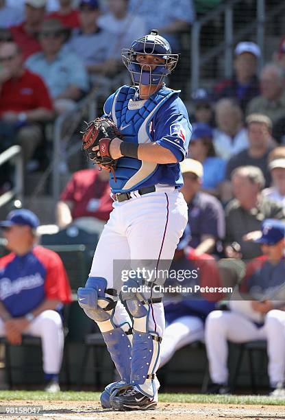 Catcher Jarrod Saltalamacchia of the Texas Rangers in action during the MLB spring training game against the Cleveland Indians at Surprise Stadium on...