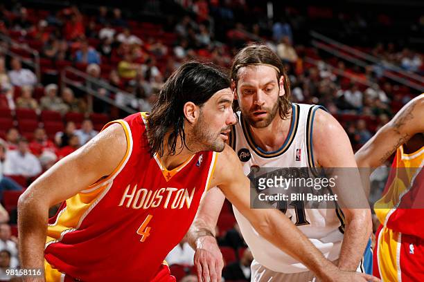 Fabricio Oberto of the Washington Wizards and fellow Argentinian Luis Scola of the Houston Rockets wait to rebound the ball on March 30, 2010 at the...