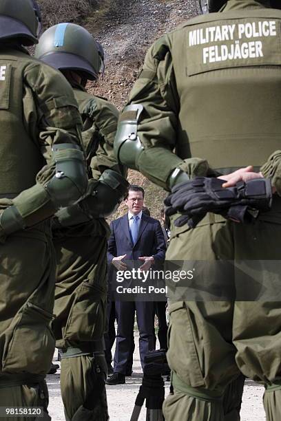 German Defense Minister Karl-Theodor zu Guttenberg poses with Bundeswehr soldiers near the Serbian Orthodox Archangel Cloister during a two-day visit...