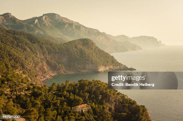 rocky mountains along coastline in fog, serra de tramuntana, mallorca, balearic islands, spain - mallorca stock pictures, royalty-free photos & images