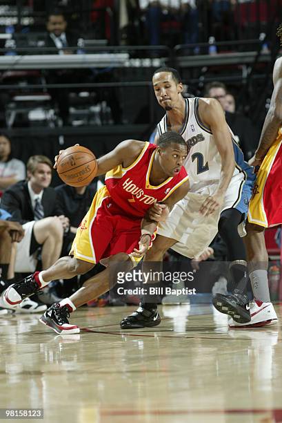 Kyle Lowry of the Houston Rockets drives the ball past Shaun Livingston of the Washington Wizards on March 30, 2010 at the Toyota Center in Houston,...