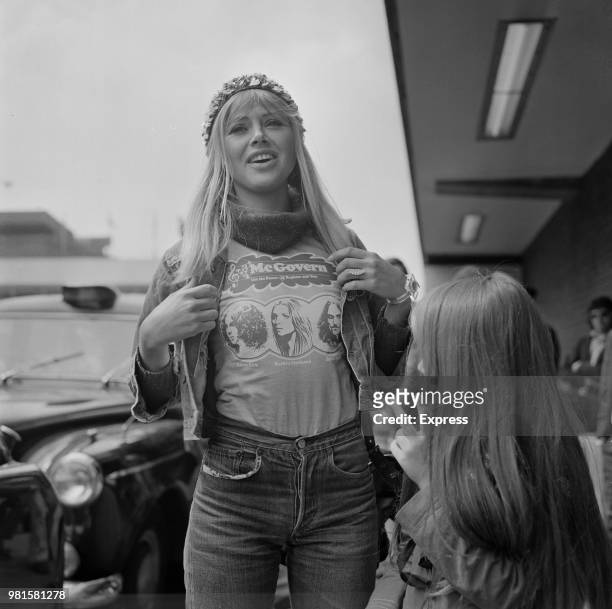 Swedish actress Britt Ekland pictured wearing a pro - George McGovern t-shirt at Heathrow airport in London on 19th April 1972. George McGovern is...