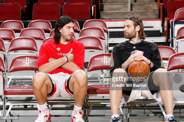 Fabricio Oberto of the Washington Wizards talks with fellow Argentinian Luis Scola of the Houston Rockets on March 30, 2010 at the Toyota Center in...