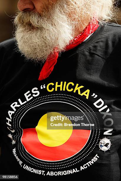 Man wearing a Charles "Chicka" Dixon shirt attends the state funeral for Australian Aboriginal leader and activist Charles "Chicka" Dixon at Sydney...