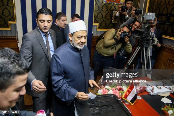 Grand Imam of al-Azhar Ahmed el-Tayeb casts his vote on the first day of the 2018 Egyptian presidential elections, at a polling station, in Cairo,...
