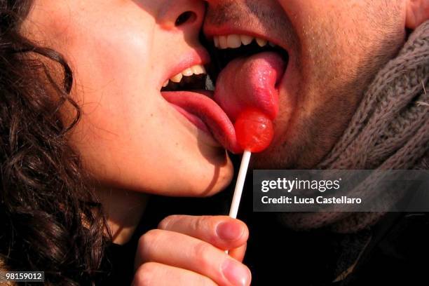 lollipop love toungue kiss - toungue out stock pictures, royalty-free photos & images