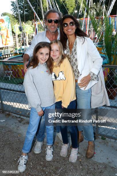 Stephane Freiss, his wife Ursula with their daughters Camille and Bianca attend the Fete Des Tuileries on June 22, 2018 in Paris, France.