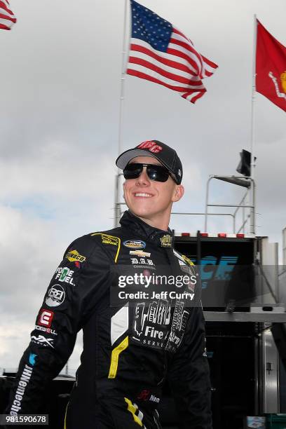 John Hunter Nemechek, driver of the NEMCO Motorsports Chevrolet, walks through the garage during practice for the NASCAR Camping World Truck Series...