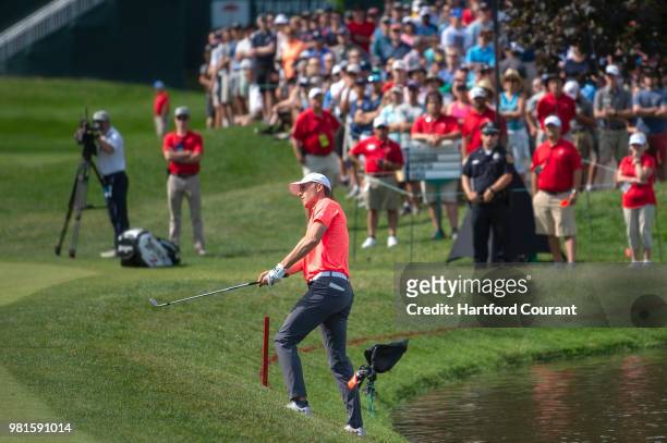 On his way to bogeying the 15th hole, Jordan Spieth, the 2017 Travelers champion, chips onto the 15th green during the second round of the Travelers...