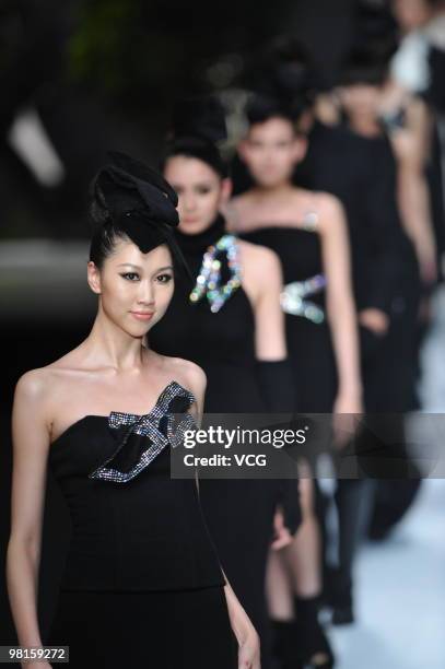 Models walk on the catwalk during the Colombina collection show at the 2010 China Fashion Week A/W on March 29, 2010 in Beijing, China.