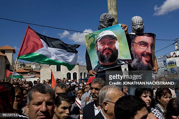 Israeli Arabs carry portraits of Lebanese Hezbollah Chief Hassan Nasrallah and assasinated Hezbollah military leader Imad Mughniyeh during a...